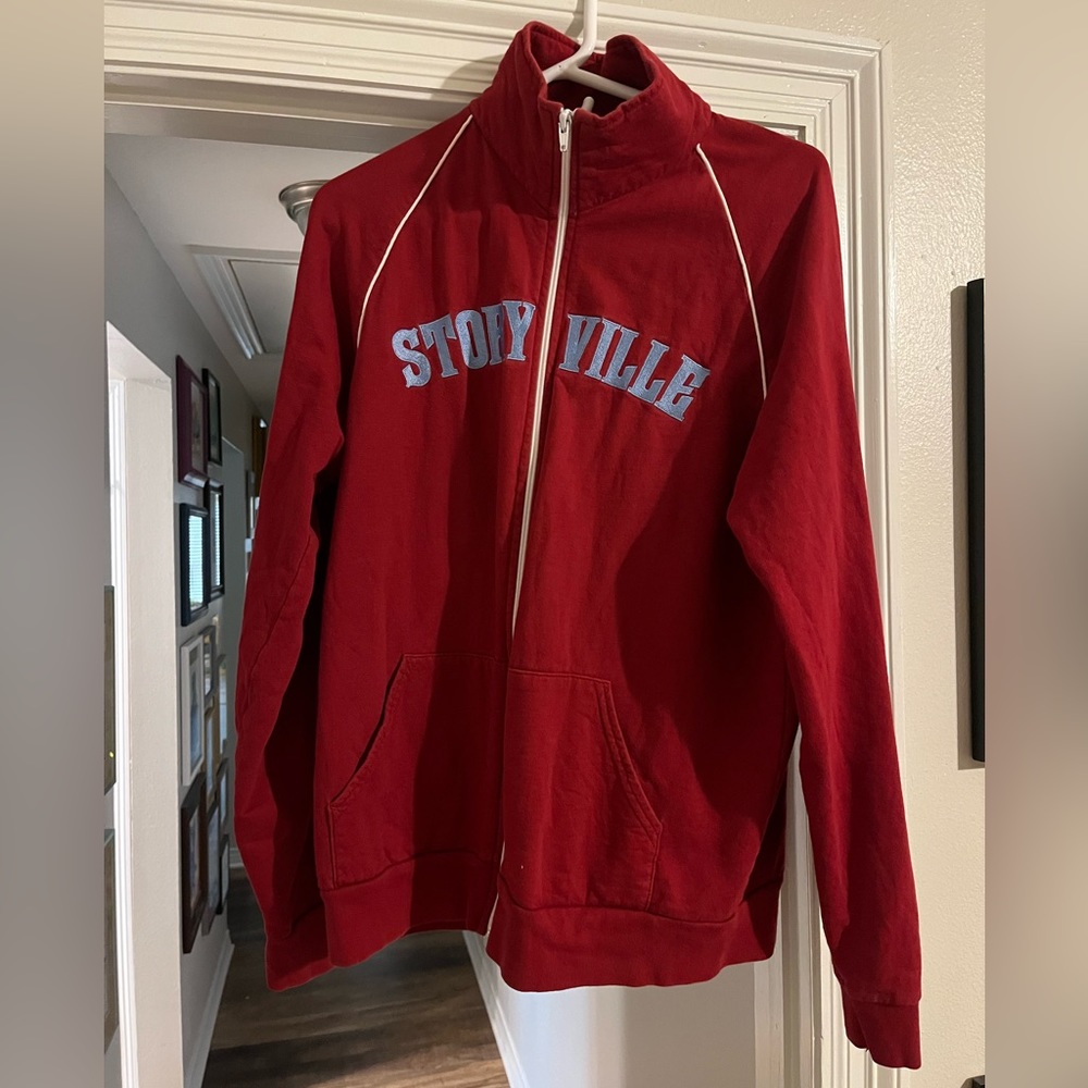 American Apparel Size Large Zip Up Track Jacket “Storyville” embroidered on it
